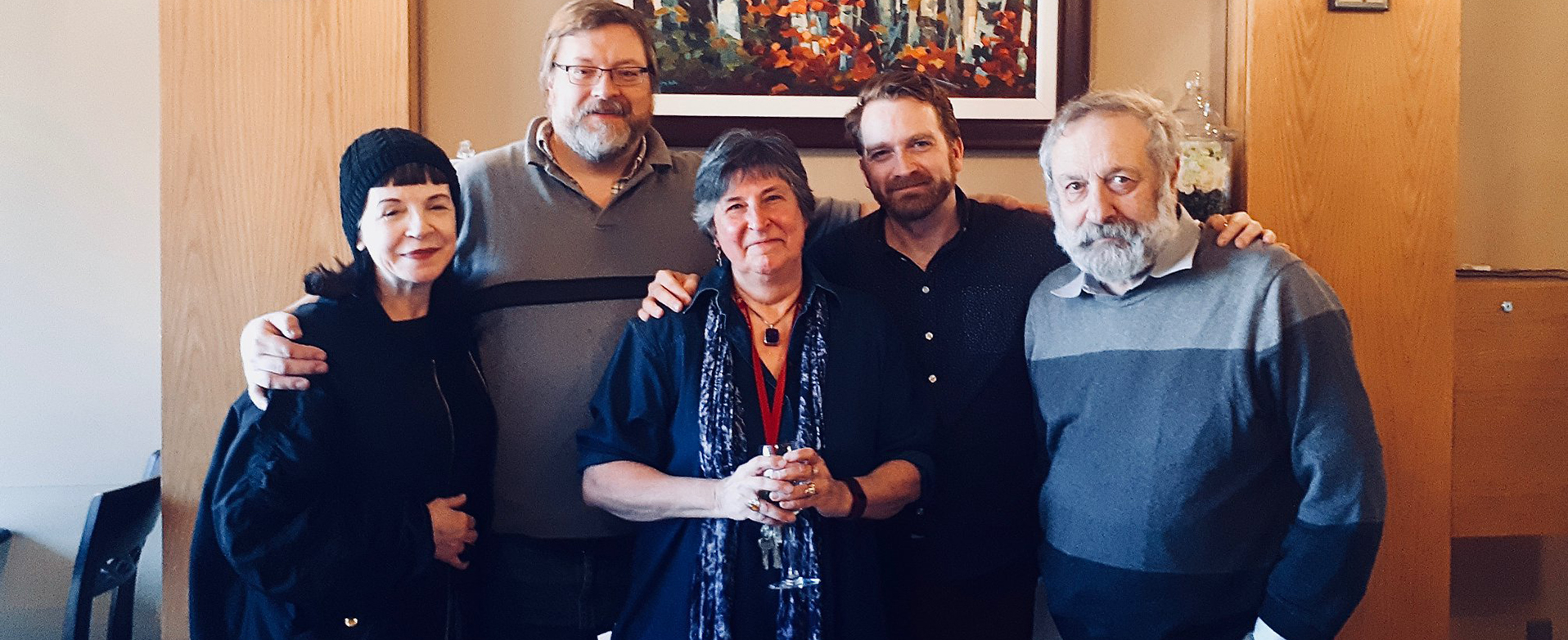 five staff and or faculty looking at the camera