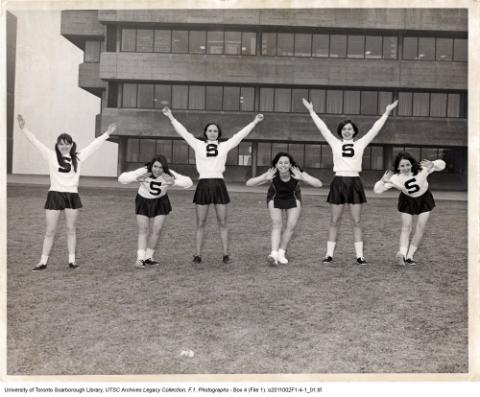 Women's Cheerleading Team in front of Administration Building