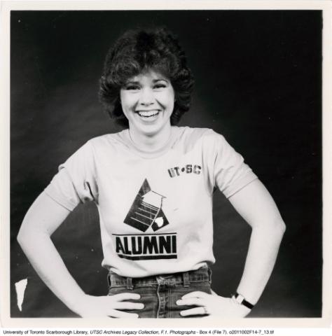 Student posing in a UTSC Alumni t-shirt