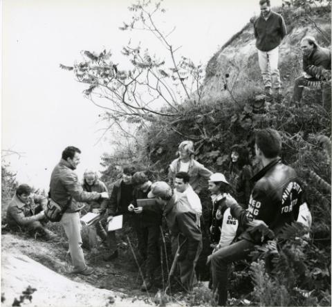 Students attending outdoor lecture (bluffs?)