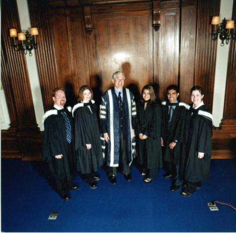 Birgeneau with students in convocation robes