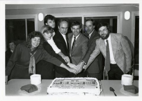 Principal Thompson, Councillor Ron Moeser and others cutting a cake celebrating the opening on the North Village Centre, November 23 1990