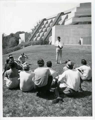 Students taking class outside in front of the science building