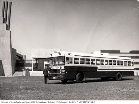 School bus with Driver in front of Recreation Wing