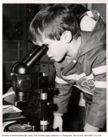 Child looking through a microscope, Science Open House