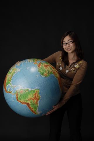 Social Science Student, with Globe, Promotional Photograph