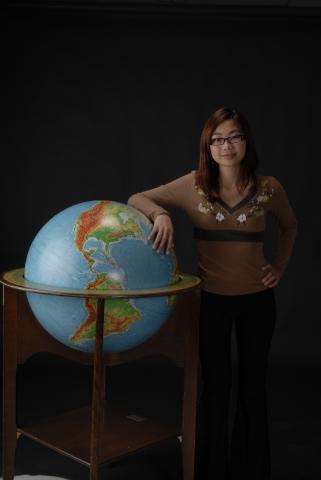 Social Science Student, with Globe, Promotional Photograph