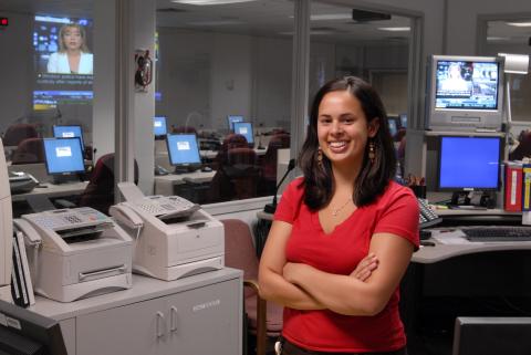 Co-op Student Standing in Control Room, Psychology Co-op Placement, Emergency Management Ontario