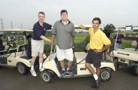 Three People Standing by Golf Carts, Management Alumni Association Golf Tournament, 2002, Deer Creek Golf Club