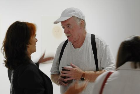 Artist Ron Giii Talks with Woman at his Exhibition, Doris McCarthy Gallery