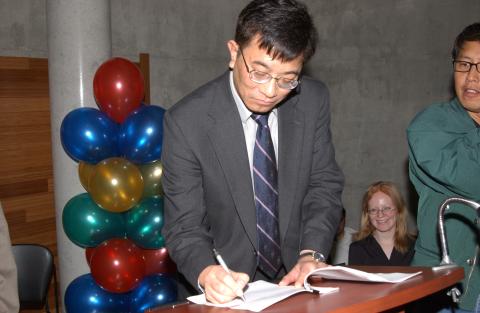 Kwong-loi Shun Writing at Lectern, Student Centre Opening, Bluffs Event Space