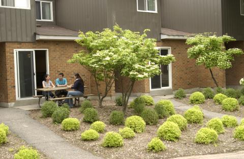 Students Sitting at Picnic Table, Residence Townhouse, Promotional Image