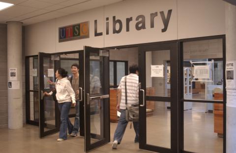 Library Entrance Doors, With Students Entering and Exiting the Library