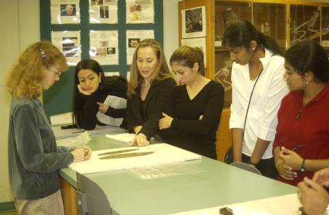 Anthropology Class Looks at Artifacts on Table
