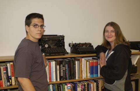 Co-op Students Standing by Bookcase, Arts Management Co-op Placement, Harbourfront, Toronto