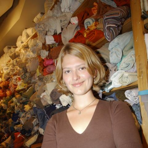 Co-op Student Poses with Racks of Fabric, Stratford, Arts Management Co-op Placement, Stratford Festival, Stratford, Ontario