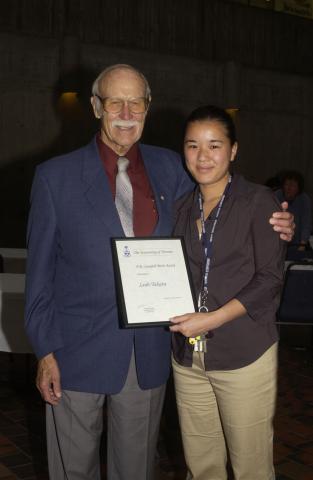 Ralph Campbell Poses for Photograph with Leah Takata, winner of 2001-2002 D.R. Campbell Merit Award