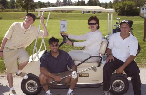 Four Golf Players Pose at Golf Cart, UTSC Management Alumni Association Golf Tournament, 2001, Deer Creek Golf Club