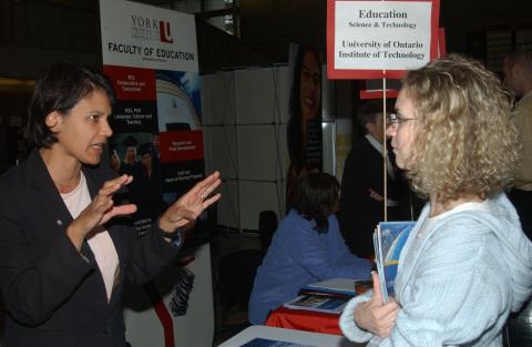 Student Speaks with Presenter, University of Ontario Institute of Technology, Graduate & Professional Schools Fair, the Meeting Place