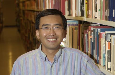 Johnson Li in Library Stacks, Promotional Image