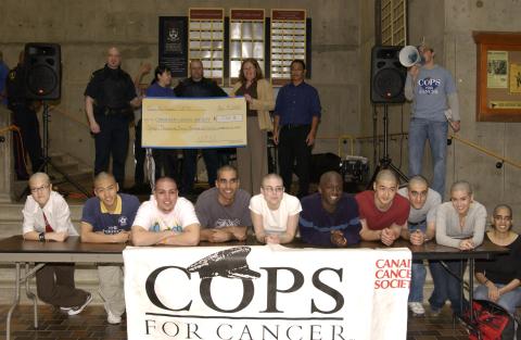 Participants with Novelty Cheque for Canadian Cancer Society, Cops for Cancer Event, the Meeting Place