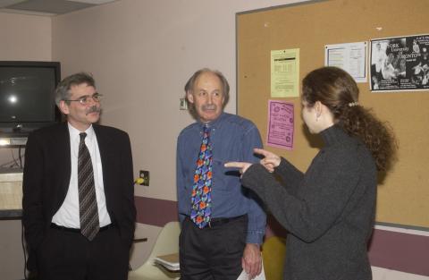 Student Speaks with Andy Mitchell and Unidentified Faculty Member