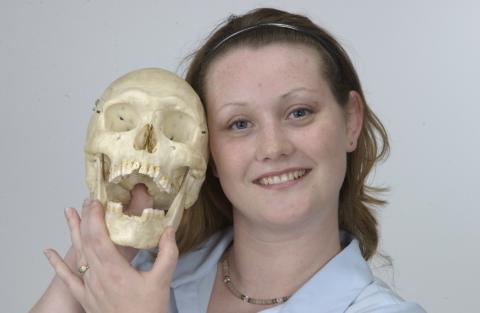 Student with Skull, Anthropology Program, Promotional Image