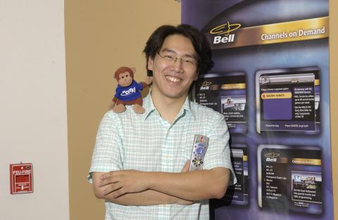 Co-op Student with Branded Stuffed Toy and Holding Remote Control, Mathematics Co-op Placement, Bell Canada, Promotional Image