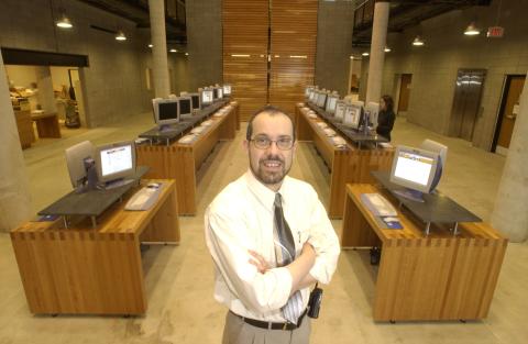 Robert Campbell Standing in Entrance Area with Catalogue Computers, UTSC Library
