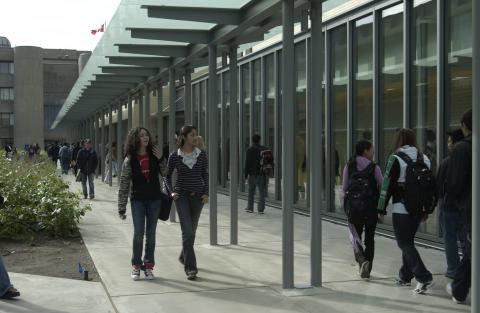 Students Walk along Pathway by Arts & Administration Building (AA)