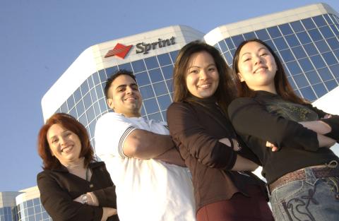 Group Poses in Front of Sprint Building, Advancement Campaign, 2003