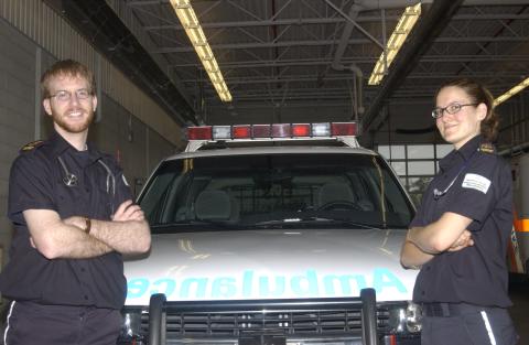 Two Paramedicine Students Standing by Ambulance, Joint Program University of Toronto and Centennial College, Promotional Image