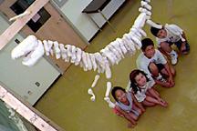 Children at Camp U of T with Dinosaur Skeleton Model