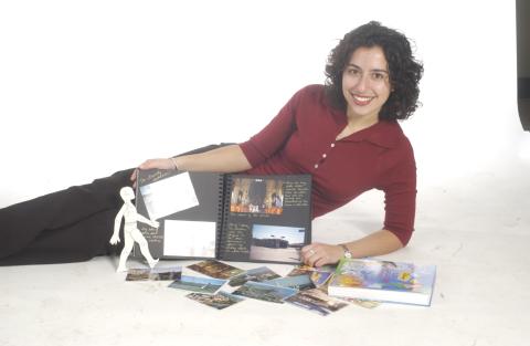 Woman Reclining, with Scrapbook (or Photograph Album), Textbook and Postcards, Studio Promotional Image