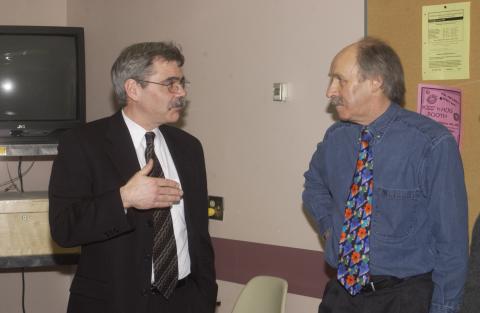 Andy Mitchell Speaks with Unidentified Faculty Member