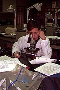 Student with Microscope in Chemistry Lab