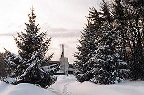 View of H-Wing Chimney Stacks through Snow Covered Pines