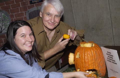 Team from Health Studies Works on Pumpkin Carving Contest Entry, the Meeting Place