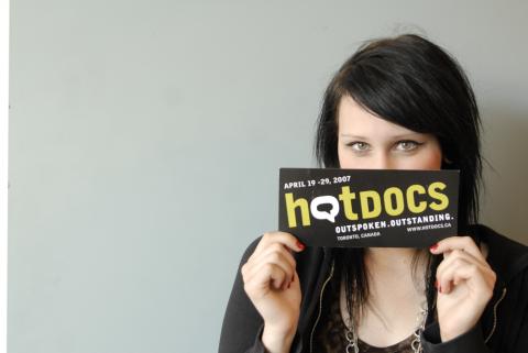 Arts Administration Co-op Student holding Hot Docs Flyer, Co-op Placement, Hot Docs