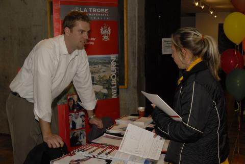Student Speaks with Presenter, La Trobe University, Graduate and Professional Schools Fair, 2006, the Meeting Place