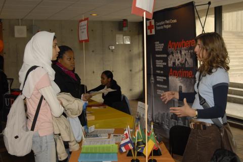 Presenter Talks to Students at Canadian Red Cross, Toronto Region Table, Expand Your Horizons: Volunteer & Internship Fair, the Meeting Place
