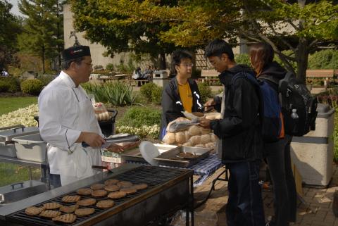 Student Being Served at Barbecue Grill, Barbecue Event, H-Wing Patio