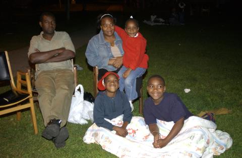 Family of Attendees Seated on Lawn to View Outdoor Screening, Summerfest, 2003