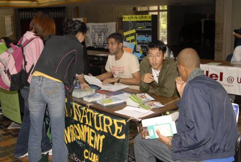Nature Environment Club, Students at Table with Sign and Literature, Clubs Event, the Meeting Place