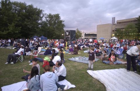 Summerfest, Attendees Sitting on Lawn, Getting Ready for Film Screening