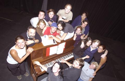 Michal Schonberg and Students Participating in Toronto Prague Theatre Project Gather around Piano