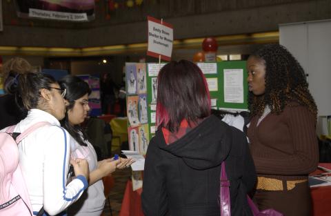 Students Speak with Presenter at Table, Emily Stowe Shelter for Women (Scarborough), Volunteer Fair, the Meeting Place