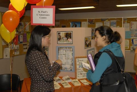 Student Speaks with Presenter at St. Paul's L'Amoreaux Centre Table, Expand Your Horizons: Volunteer & Internship Fair, the Meeting Place
