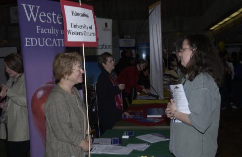 Student Speaking with Presenter, Faculty of Education, University of Western Ontario, Professional and Graduate School Fair, the Meeting Place