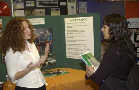 Student Speaking with Presenter, Canadian Memorial Chiropractic College, Professional and Graduate School Fair, the Meeting Place